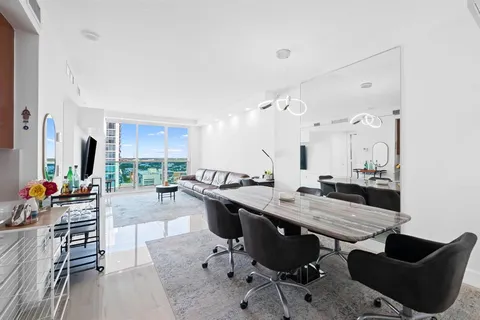 a view of a kitchen and dining room