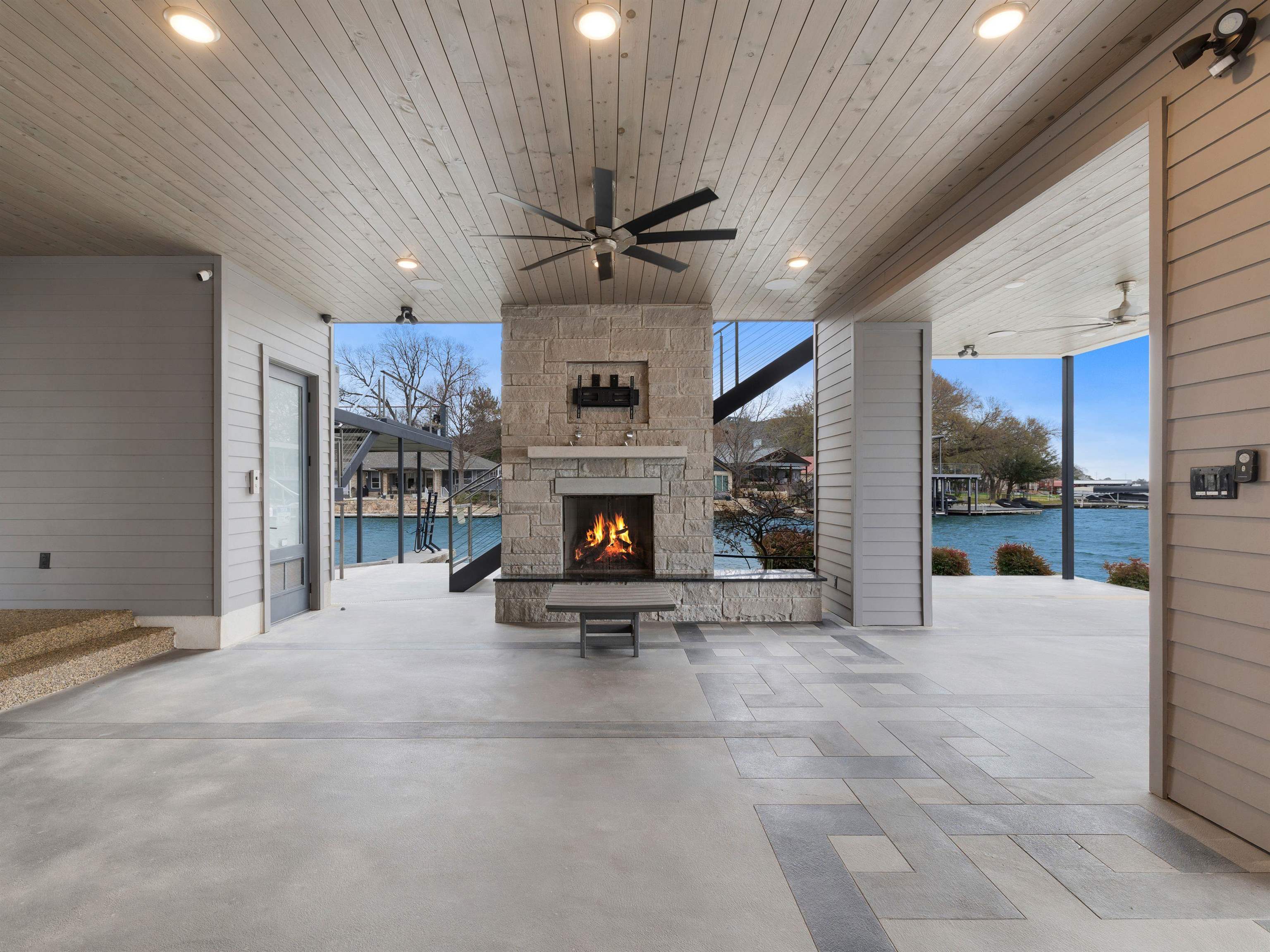 107 Paradise Point Kingsland, TX 78639 - Photo 28 of 40 a view of a livingroom with a fireplace a ceiling fan a fireplace and a window