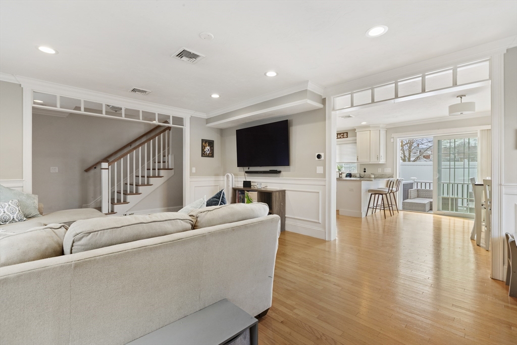 113 Elm Street, Unit D Quincy, MA 02169 - Photo 12 of 39 a living room with furniture and a flat screen tv