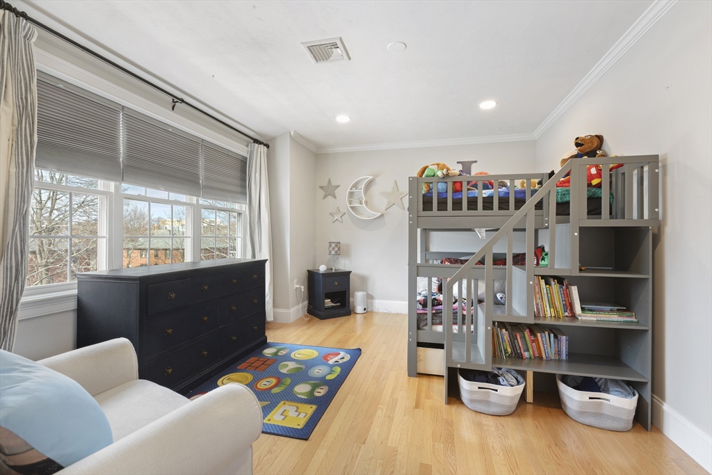 113 Elm Street, Unit D Quincy, MA 02169 - Photo 21 of 39 a living room with furniture toys and a flat screen tv