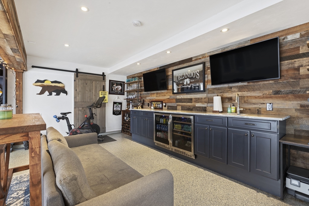 113 Elm Street, Unit D Quincy, MA 02169 - Photo 25 of 39 a living room with stainless steel appliances furniture and a flat screen tv
