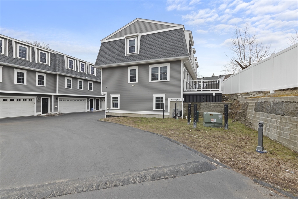 113 Elm Street, Unit D Quincy, MA 02169 - Photo 33 of 39 a view of a house with backyard and sitting area