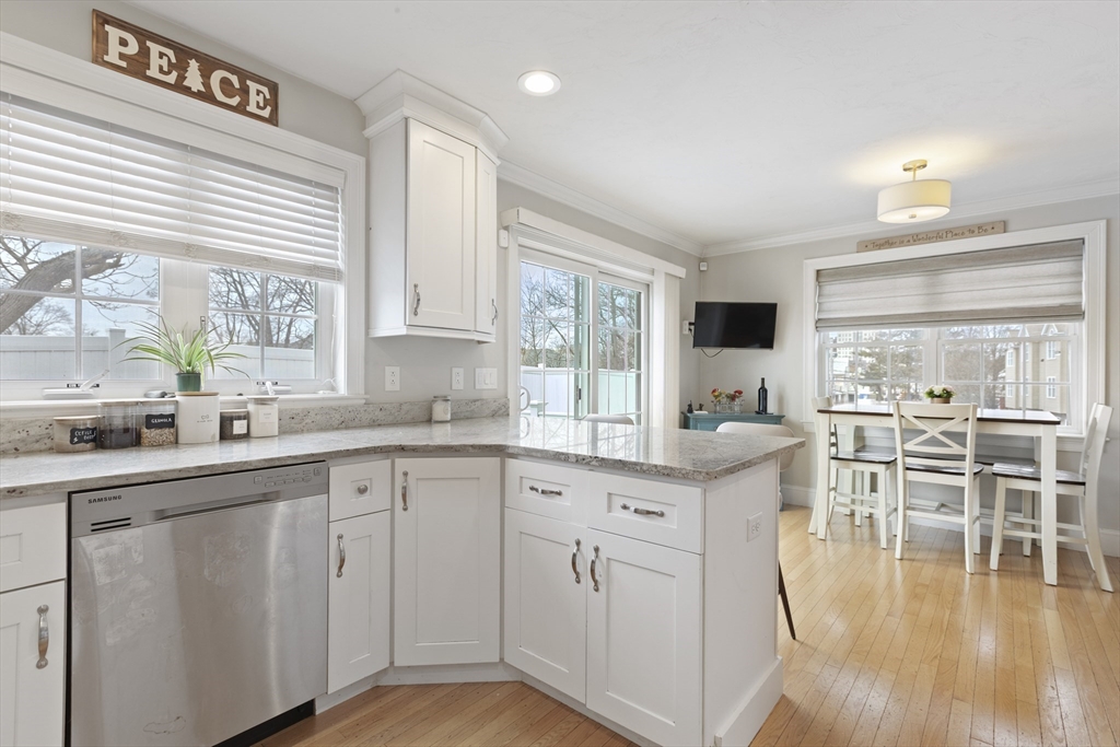 113 Elm Street, Unit D Quincy, MA 02169 - Photo 8 of 39 a kitchen with stainless steel appliances granite countertop a stove and cabinets