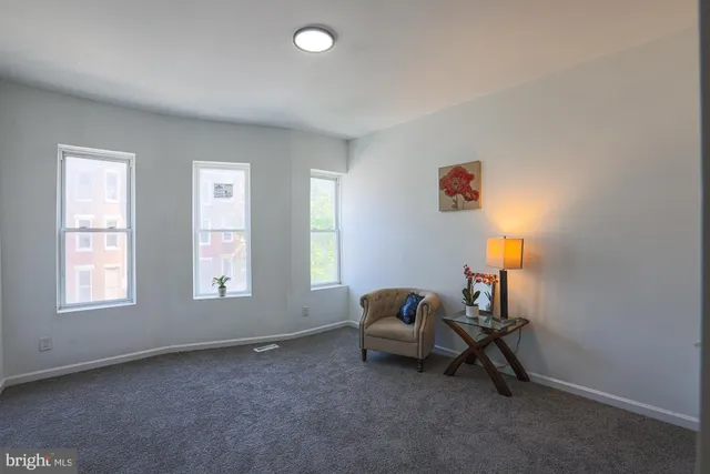 a livingroom with furniture and windows