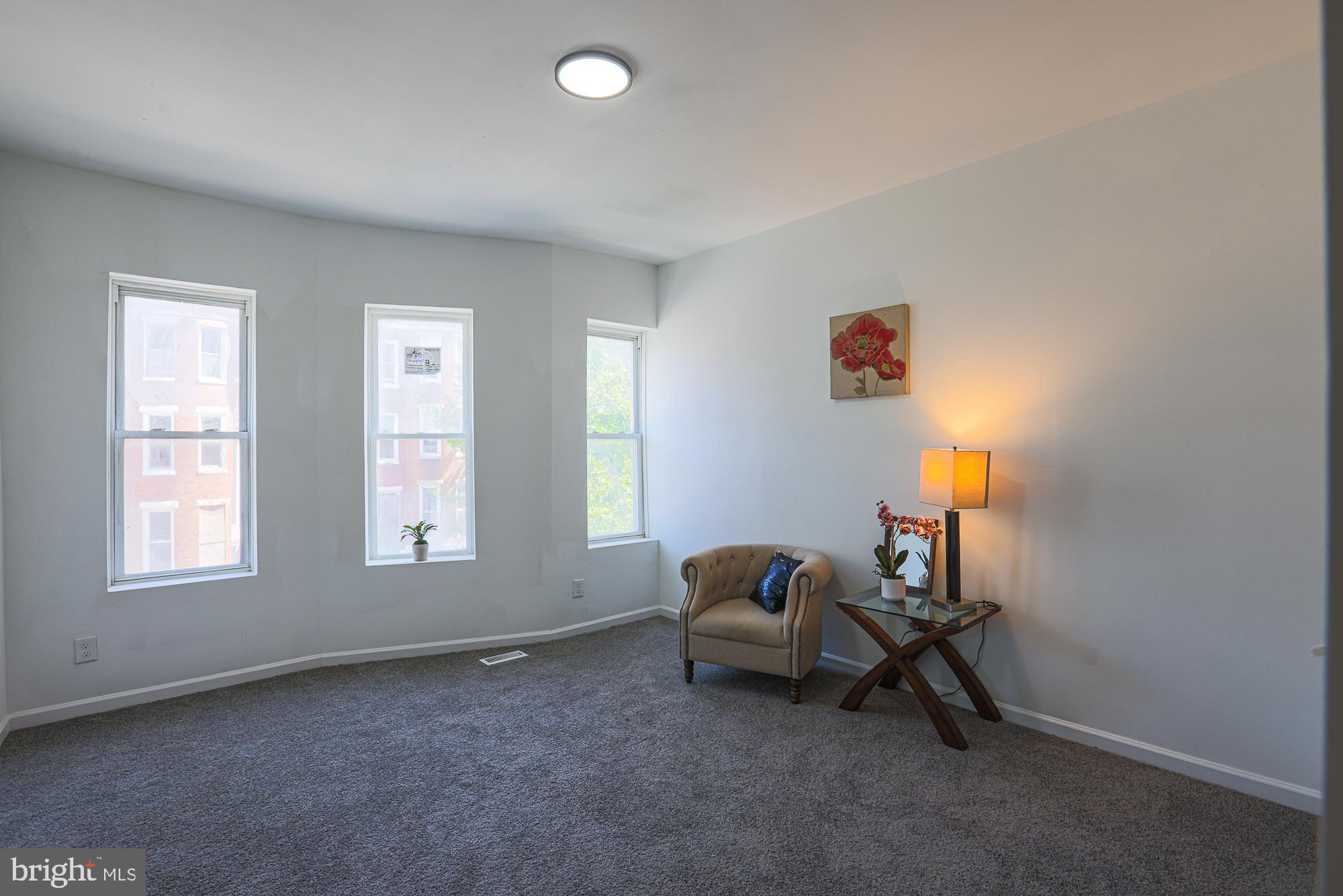 1909 Mosher Street Baltimore, MD 21217 - Photo 32 of 40 a living room with furniture and a window