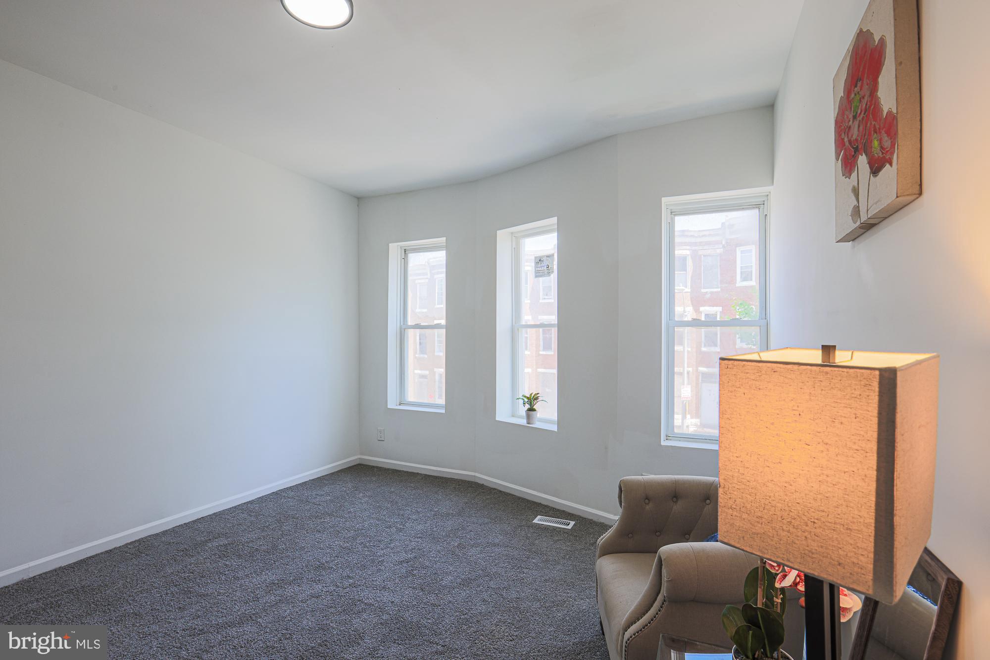 1909 Mosher Street Baltimore, MD 21217 - Photo 33 of 40 a livingroom with furniture and windows