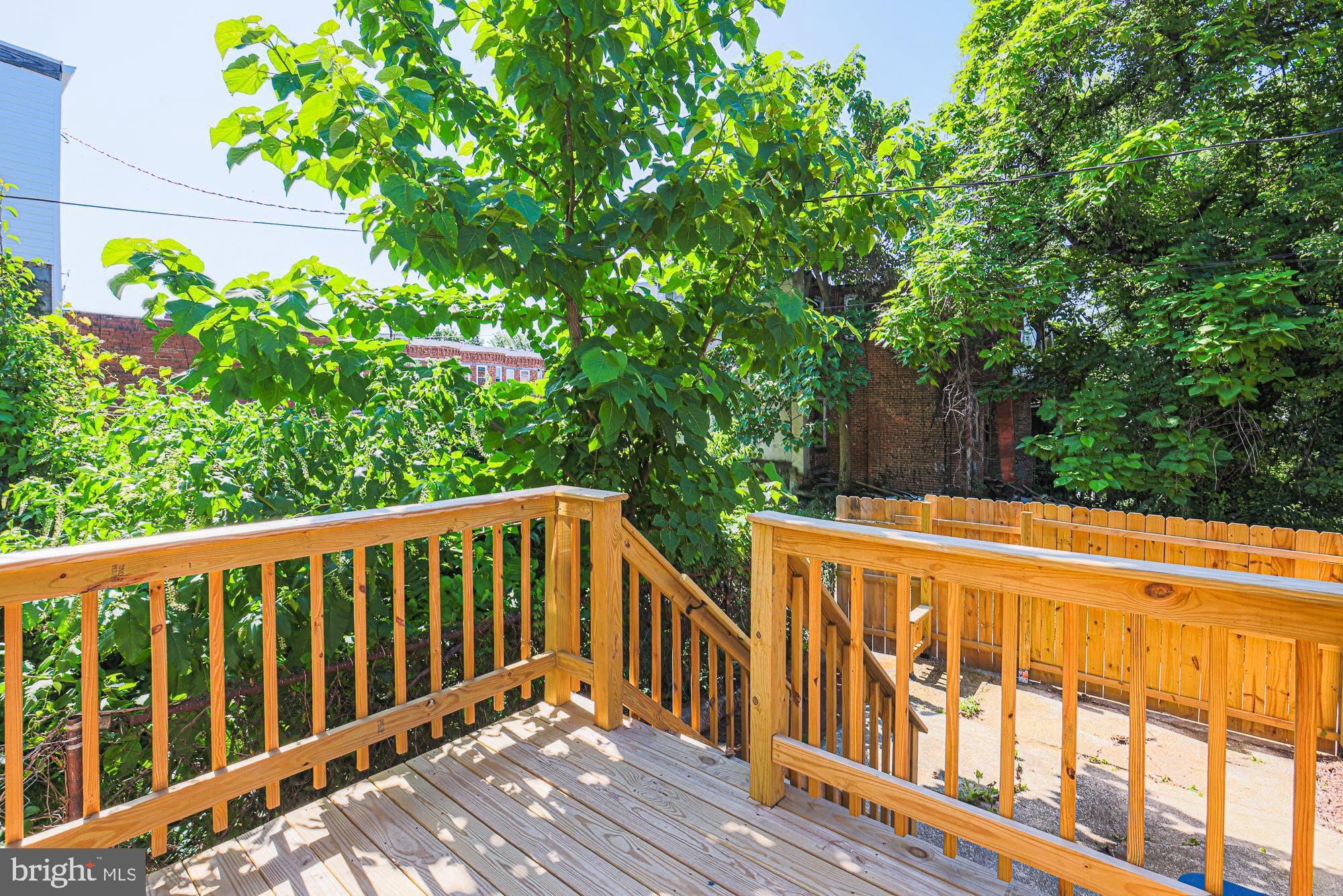 1909 Mosher Street Baltimore, MD 21217 - Photo 36 of 40 a balcony with trees in front of it