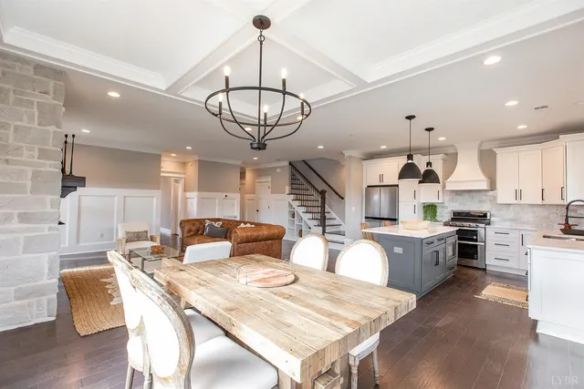 a kitchen with stainless steel appliances granite countertop a sink and cabinets with wooden floor