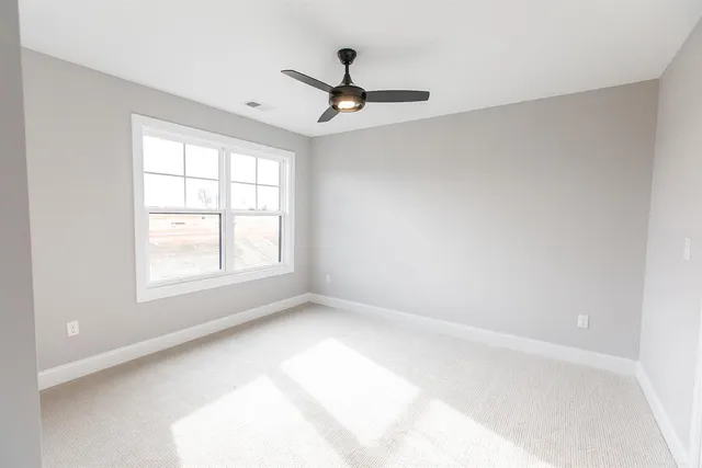 a view of a brick house with a large window