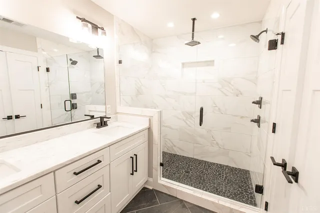 an aerial view of residential houses with outdoor space