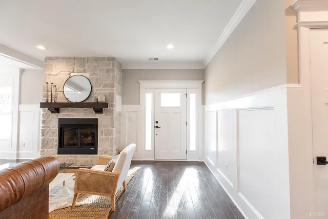 a view of living room with a fireplace and wooden floor