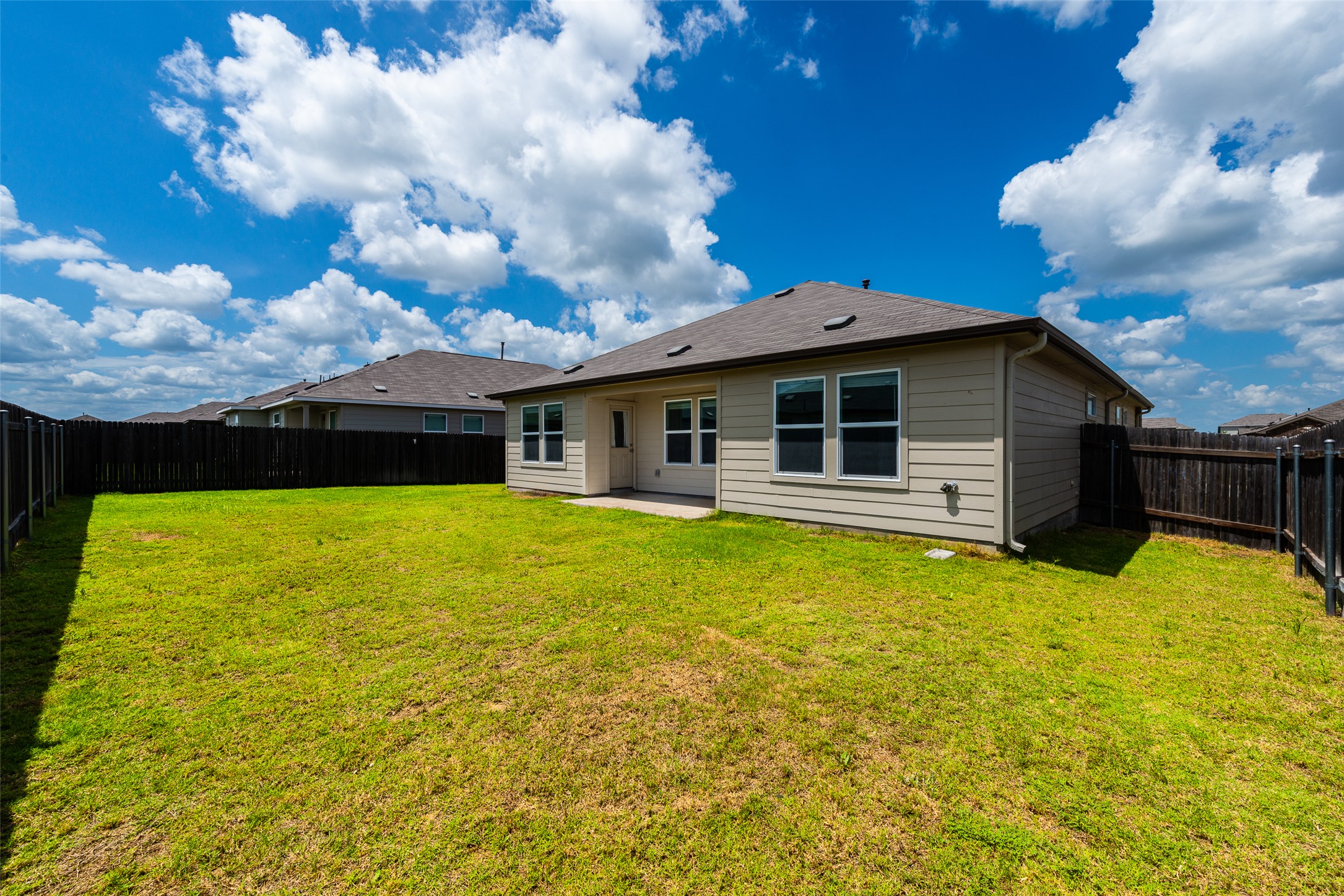 147 Otter Road Kyle, TX 78640 - Photo 28 of 34 Large back yard with sprinkler system