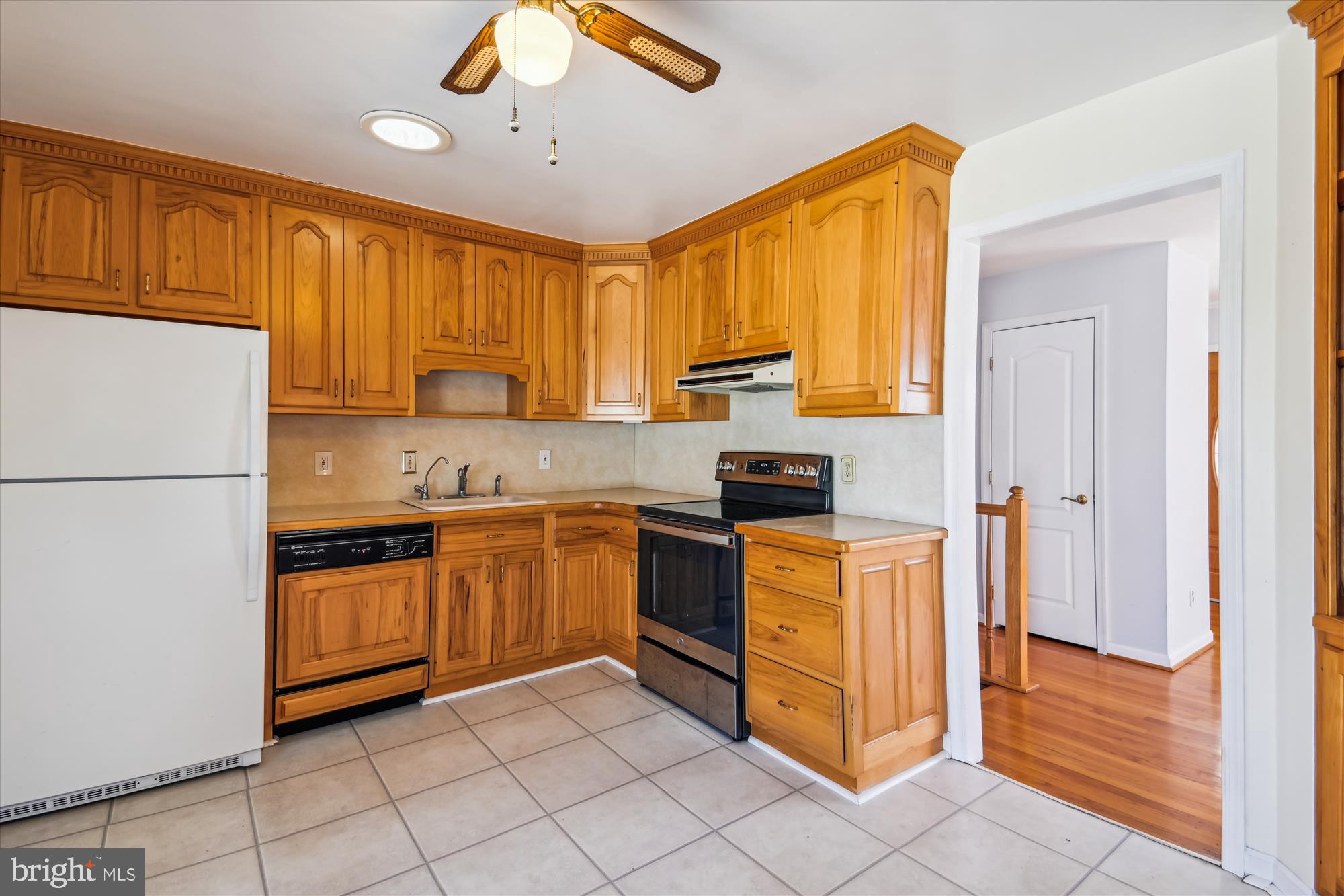1574 Melanie Road Pasadena, MD 21122 - Photo 13 of 41 a kitchen with stainless steel appliances granite countertop a refrigerator and a stove top oven