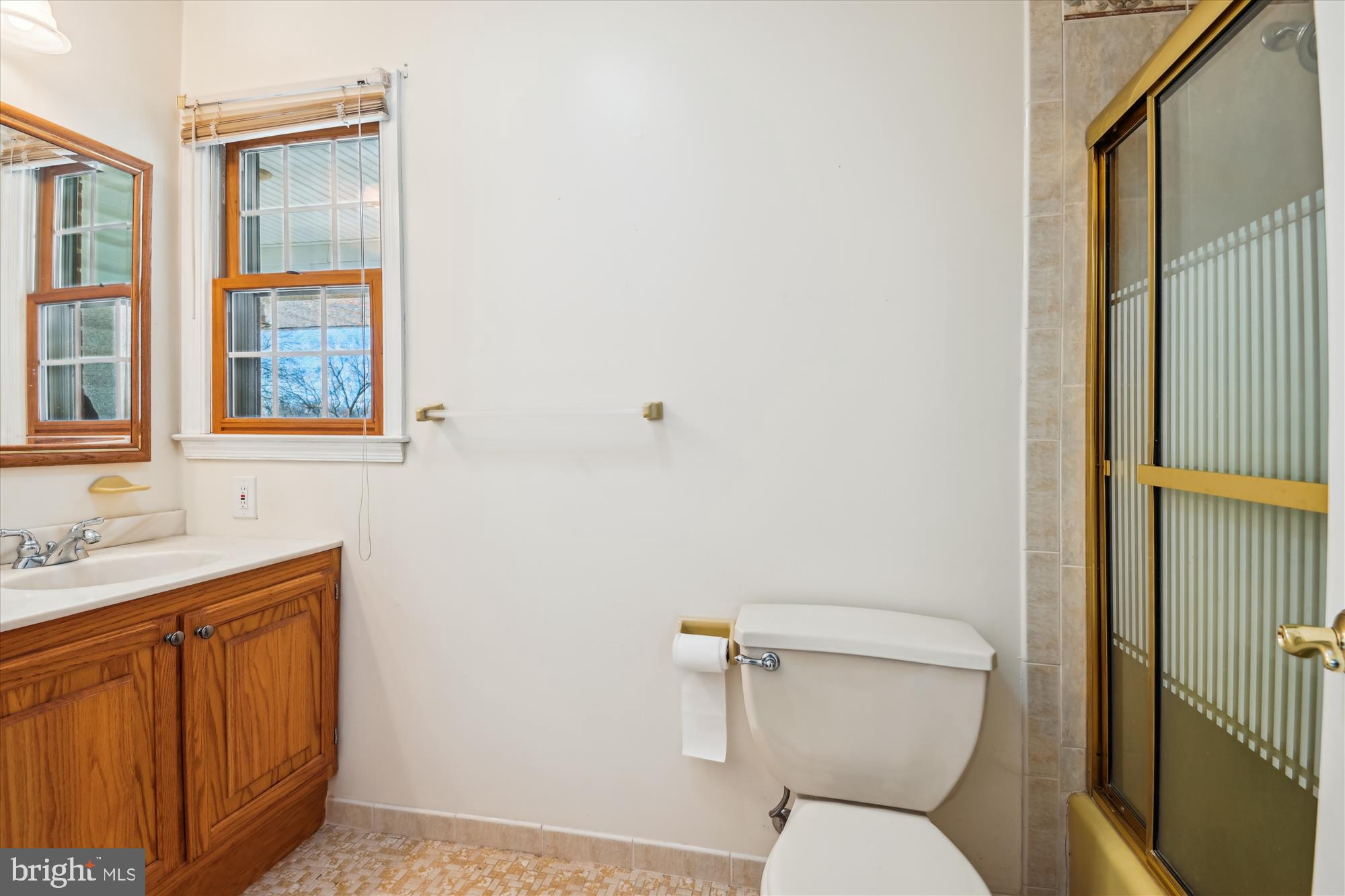 1574 Melanie Road Pasadena, MD 21122 - Photo 23 of 41 a bathroom with a toilet sink and mirror