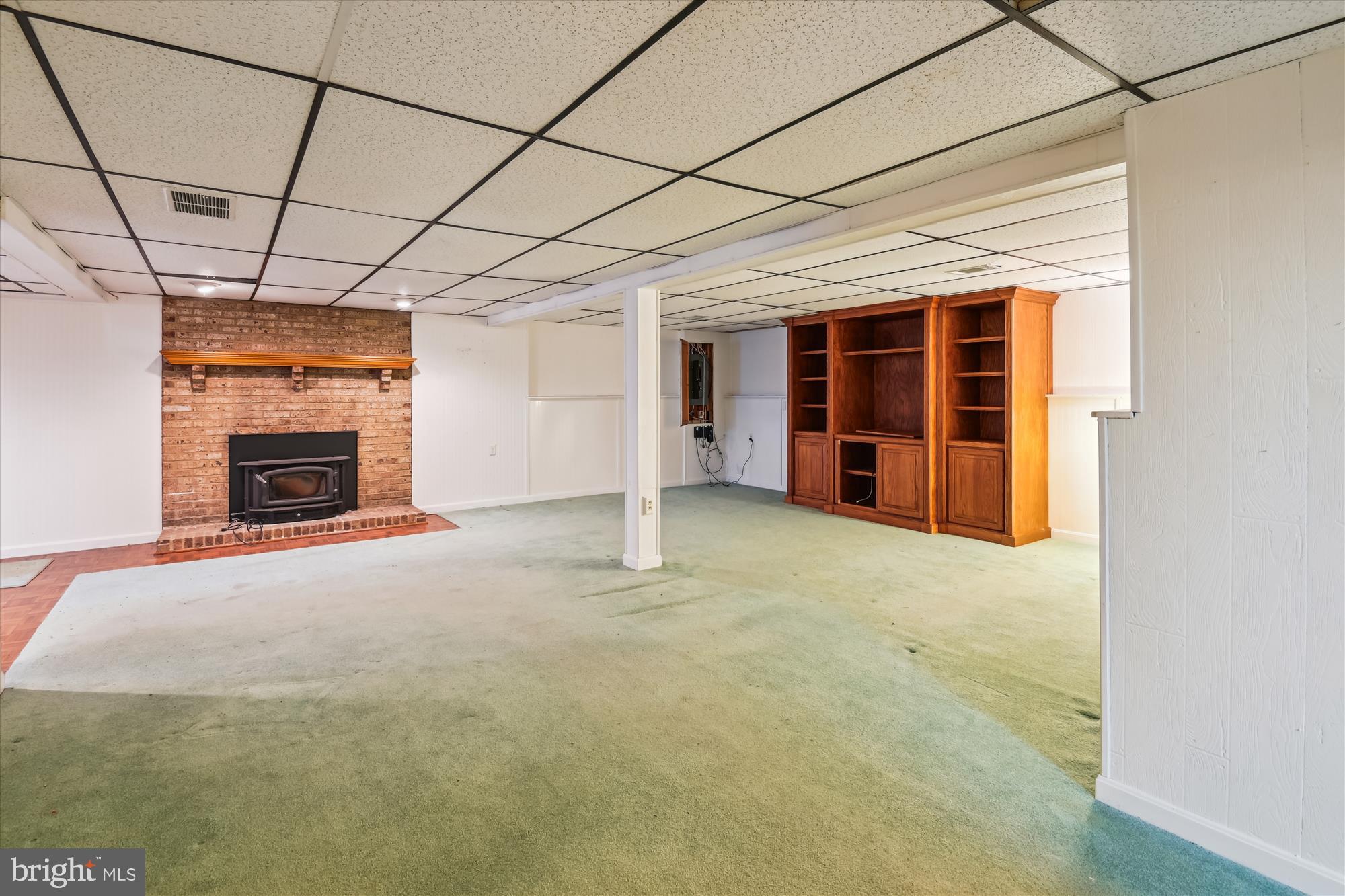 1574 Melanie Road Pasadena, MD 21122 - Photo 24 of 41 a view of empty room with a fireplace and cabinet