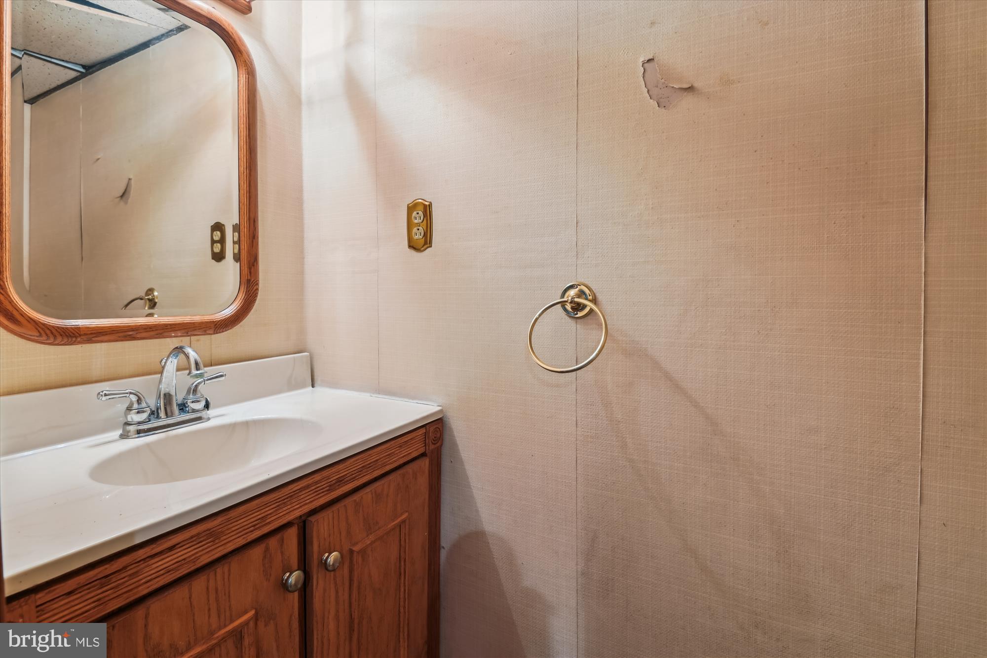 1574 Melanie Road Pasadena, MD 21122 - Photo 26 of 41 a bathroom with a sink vanity and a mirror