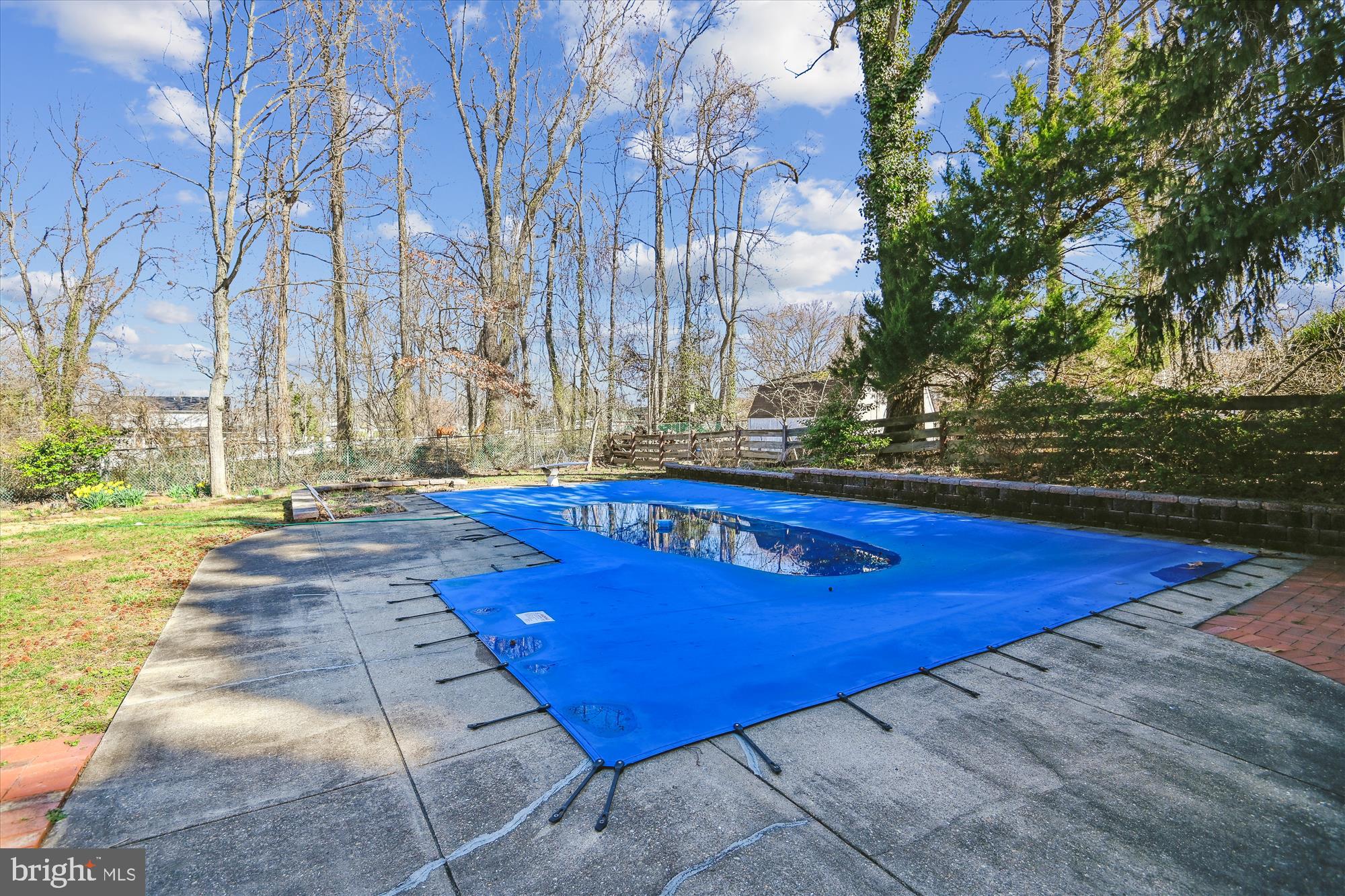 1574 Melanie Road Pasadena, MD 21122 - Photo 38 of 41 a view of a swimming pool with an outdoor space and seating area