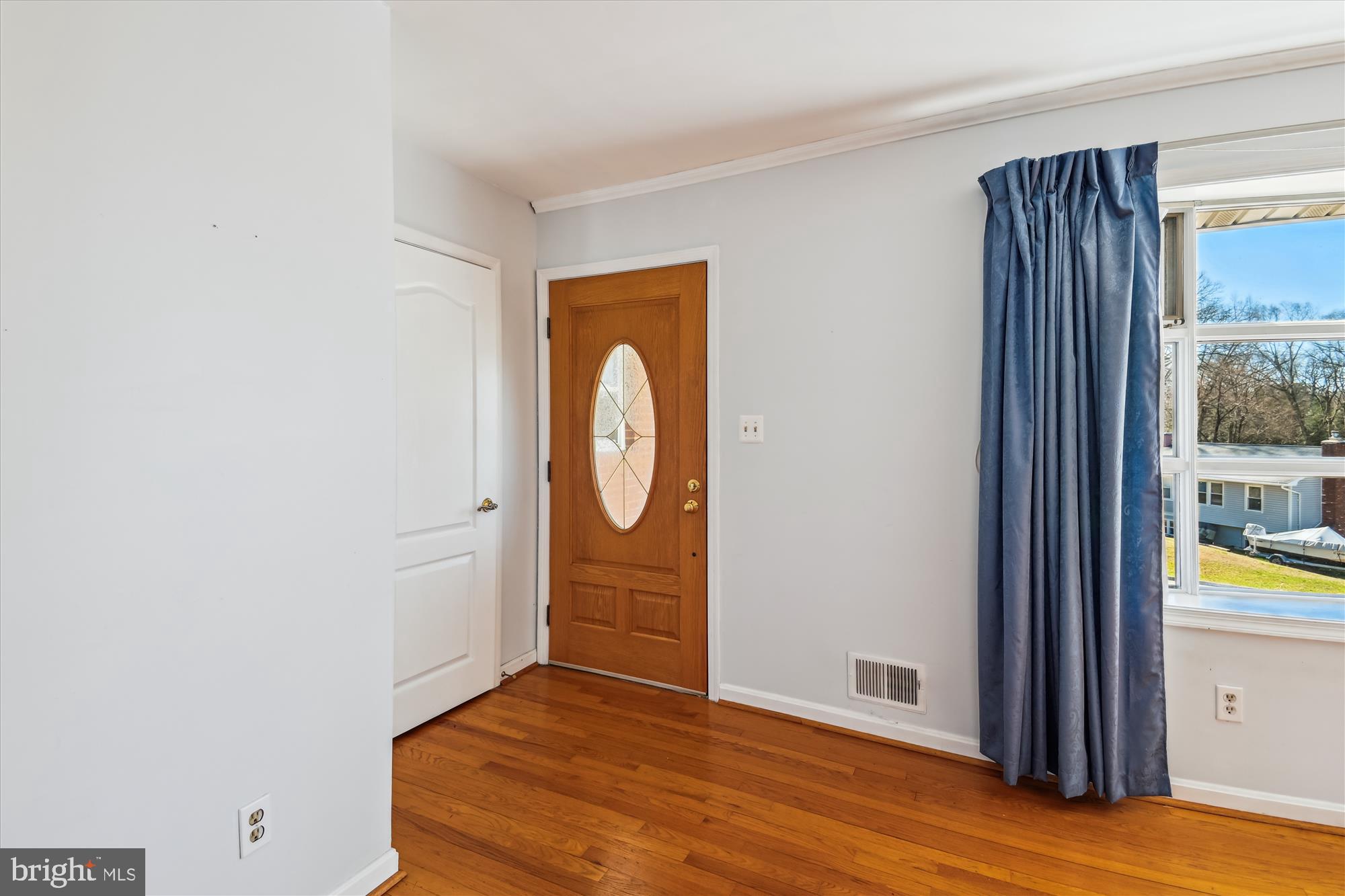 1574 Melanie Road Pasadena, MD 21122 - Photo 4 of 41 a view of an entryway with wooden floor