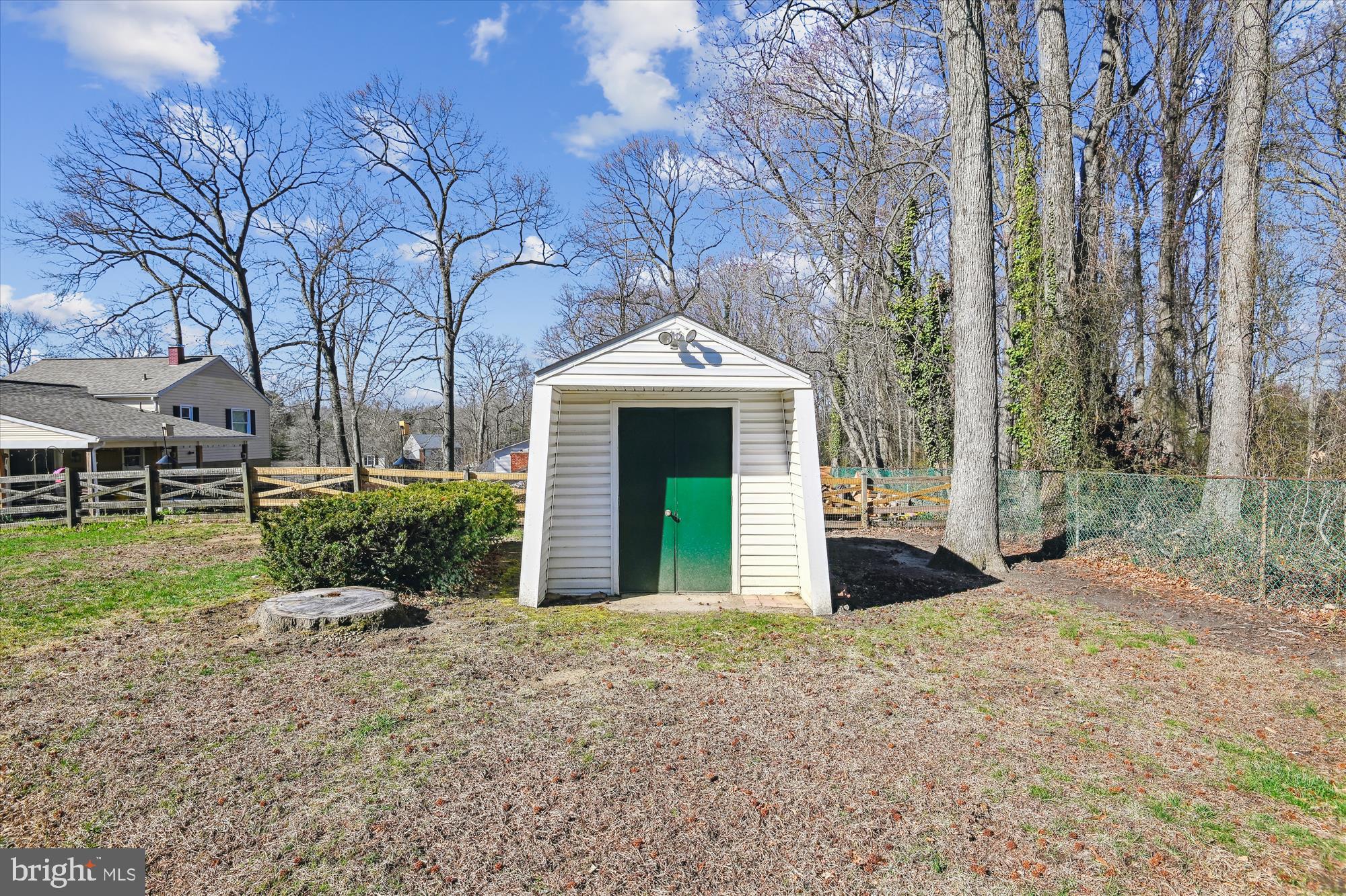 1574 Melanie Road Pasadena, MD 21122 - Photo 41 of 41 a front view of a house with garden and trees