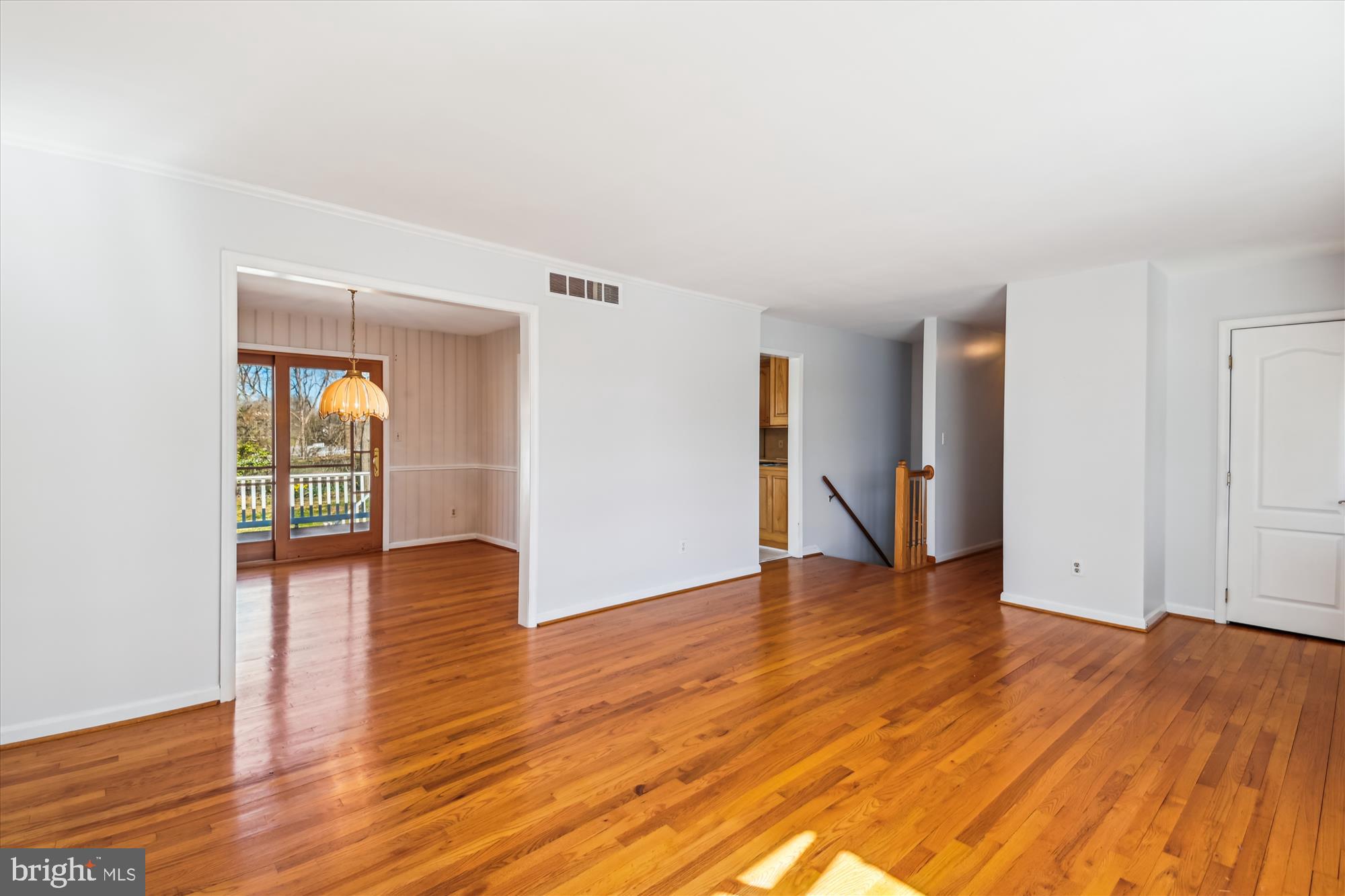 1574 Melanie Road Pasadena, MD 21122 - Photo 5 of 41 a view of an empty room with wooden floor and a window