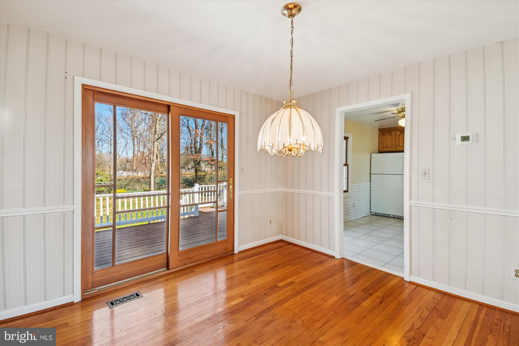 1574 Melanie Road Pasadena, MD 21122 - Photo 7 of 41 a view of empty room with wooden floor and fan