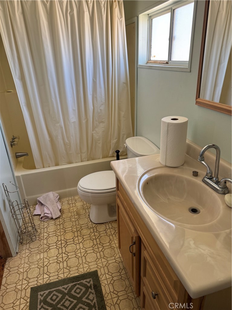10369 Fairlane Road Lucerne Valley, CA 92356 - Photo 5 of 12 a bathroom with a sink toilet and shower