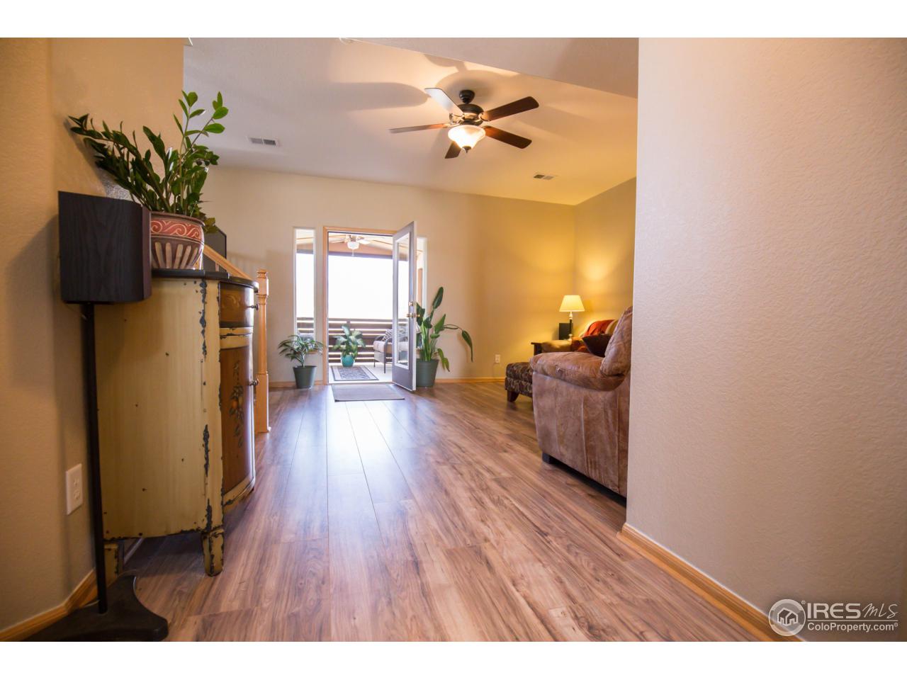 8811 19th St Road Greeley, CO 80634 - Photo 8 of 40 Front hallway into living room.
