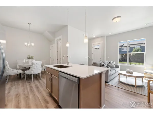 a large kitchen with a table and chairs