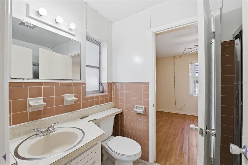 6229 Dalton Street Spring Hill, FL 34606 - Photo 19 of 44 a bathroom with a sink a toilet and shower