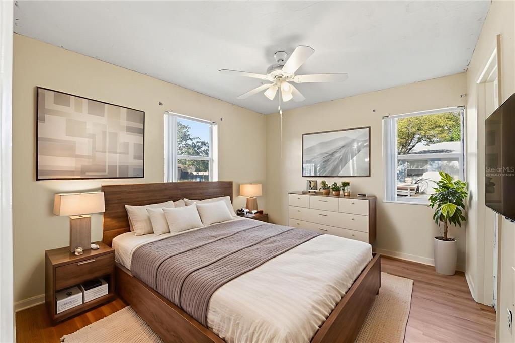 6229 Dalton Street Spring Hill, FL 34606 - Photo 22 of 44 a bedroom with a bed and a chandelier