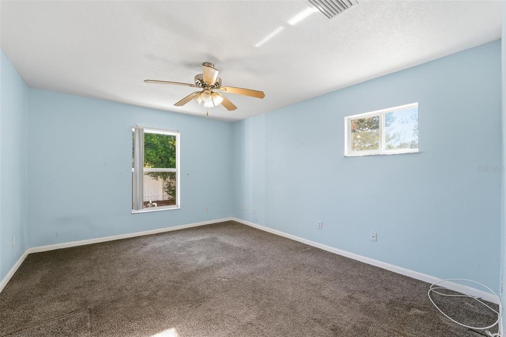6229 Dalton Street Spring Hill, FL 34606 - Photo 23 of 44 a view of an empty room with a window