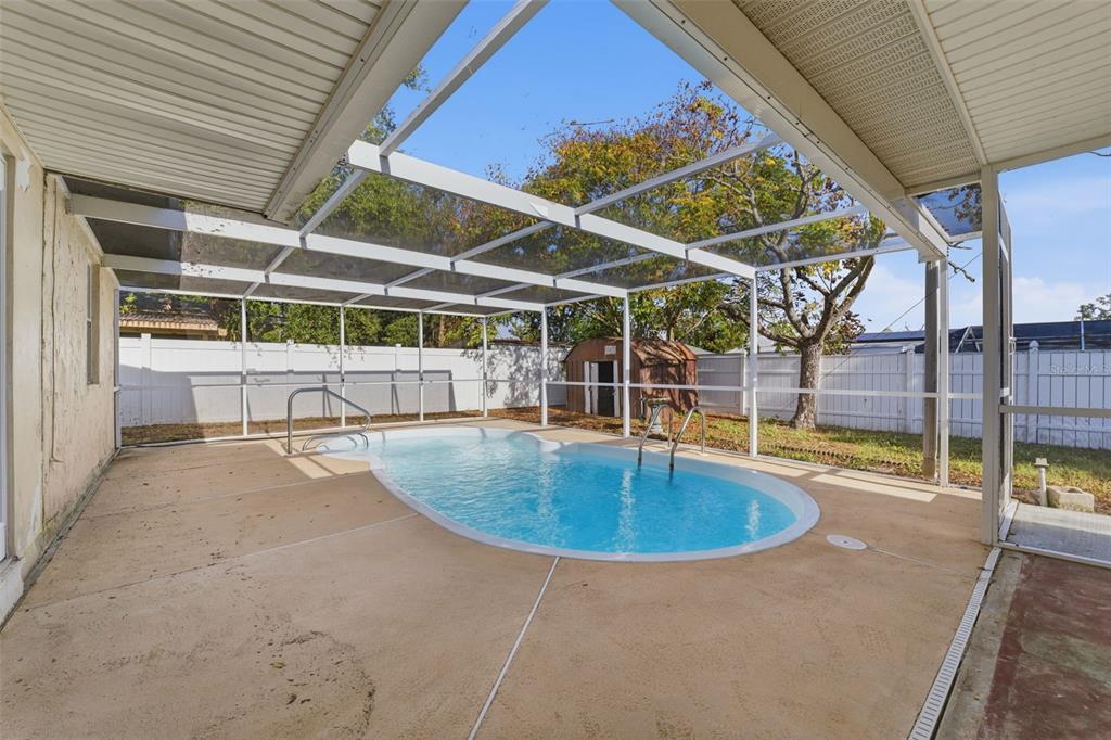 6229 Dalton Street Spring Hill, FL 34606 - Photo 25 of 44 a view of a backyard with swimming pool
