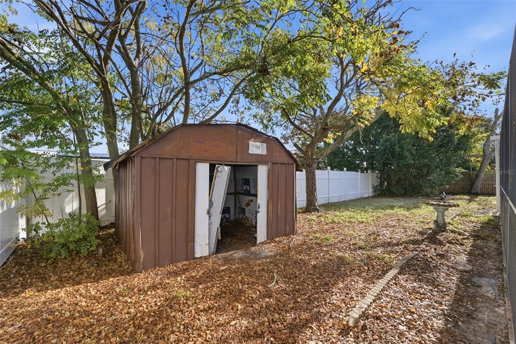 6229 Dalton Street Spring Hill, FL 34606 - Photo 31 of 44 a backyard of a house with lots of green space