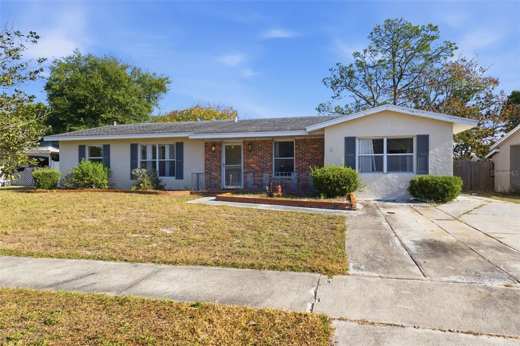 6229 Dalton Street Spring Hill, FL 34606 - Photo 34 of 44 a front view of a house with a yard