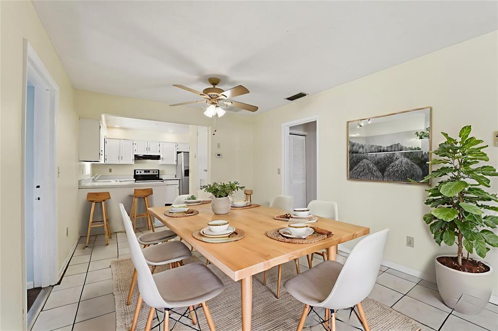 6229 Dalton Street Spring Hill, FL 34606 - Photo 9 of 44 a view of a dining room with furniture and wooden floor