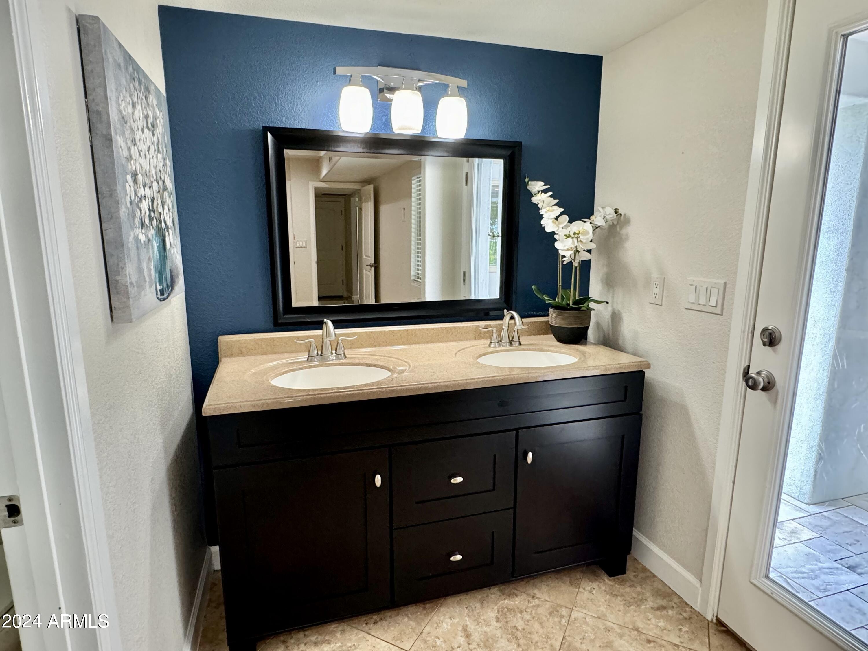 15402 North 57th Street Scottsdale, AZ 85254 - Photo 20 of 35 a bathroom with a sink and a mirror