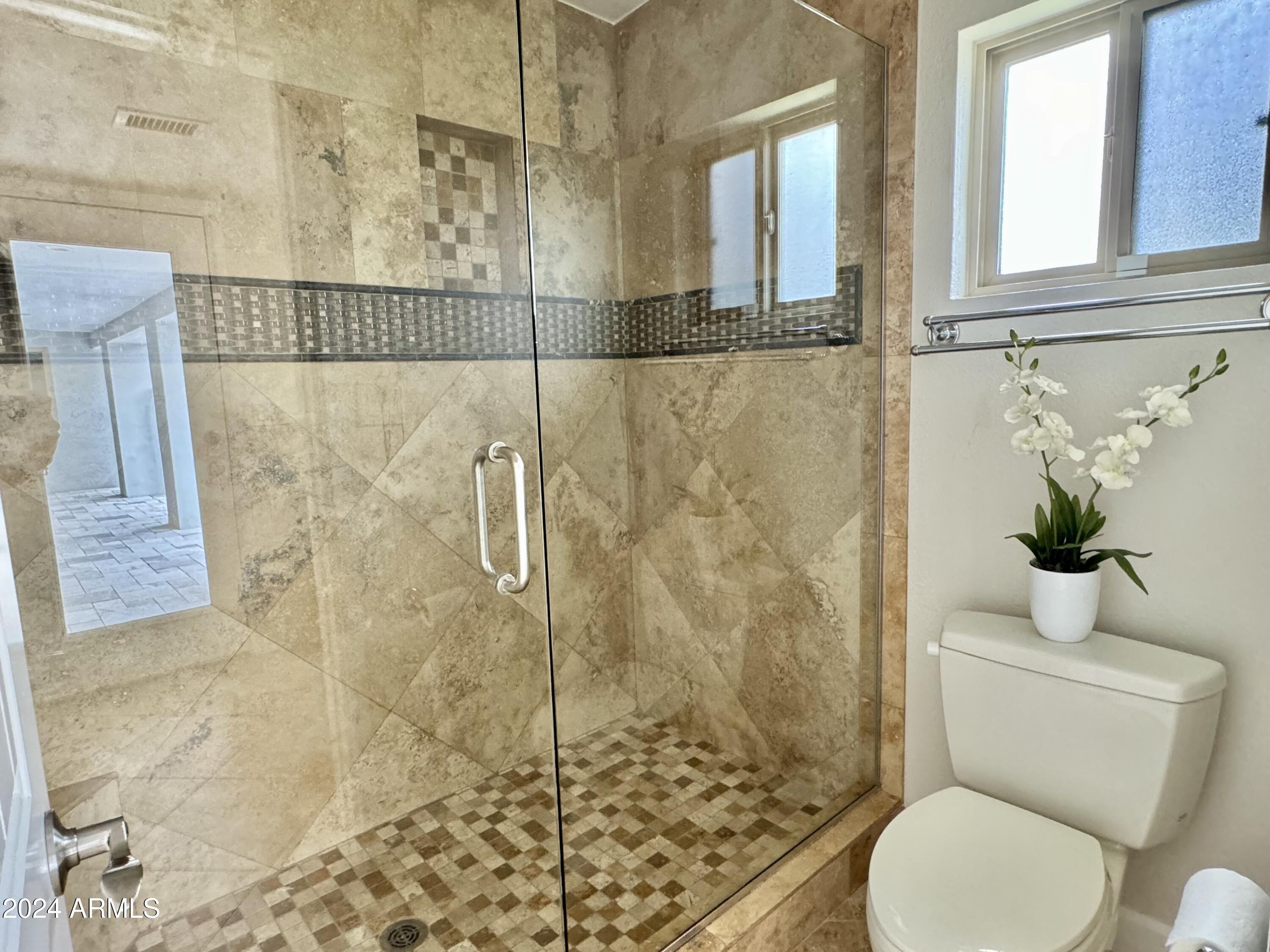 15402 North 57th Street Scottsdale, AZ 85254 - Photo 21 of 35 a bathroom with a toilet and shower