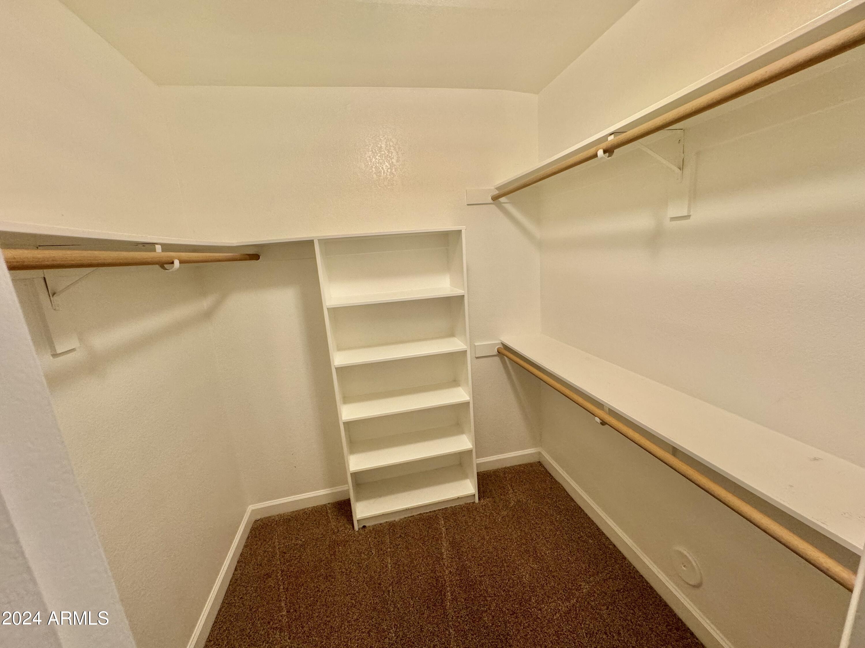 15402 North 57th Street Scottsdale, AZ 85254 - Photo 24 of 35 a view of walk in closet with empty racks