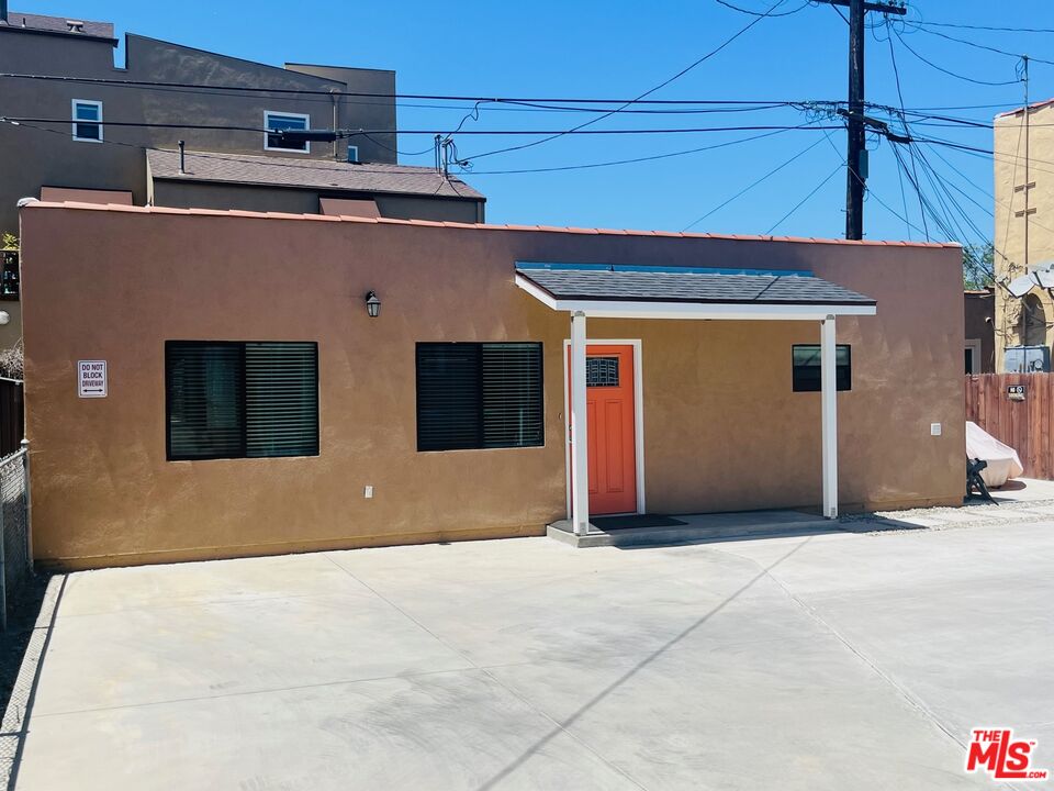 2807 Buckingham Road, Unit 1/2 Los Angeles, CA 90016 - Photo 1 of 10 a view of a building with a garage