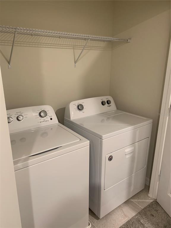 2559 Buena View Road Kissimmee, FL 34746 - Photo 16 of 17 a utility room with dryer and washer