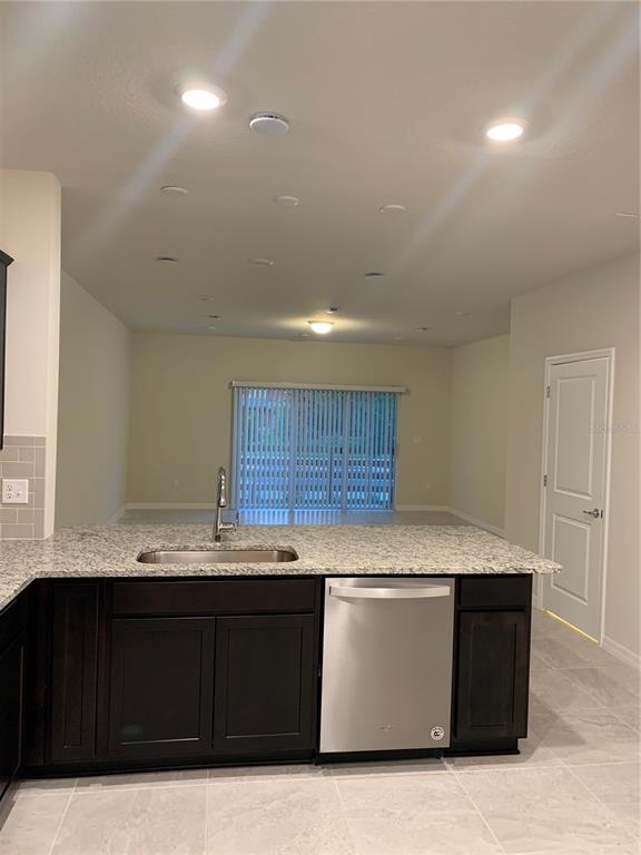 2559 Buena View Road Kissimmee, FL 34746 - Photo 4 of 17 a kitchen with a sink and a cabinets