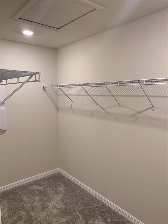 2559 Buena View Road Kissimmee, FL 34746 - Photo 6 of 17 a view of a room with racks on the wall