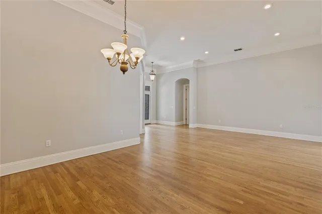 a kitchen with stainless steel appliances granite countertop a sink and a stove top oven