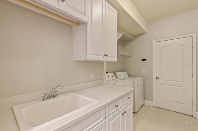 a view of a big room with windows and entryway