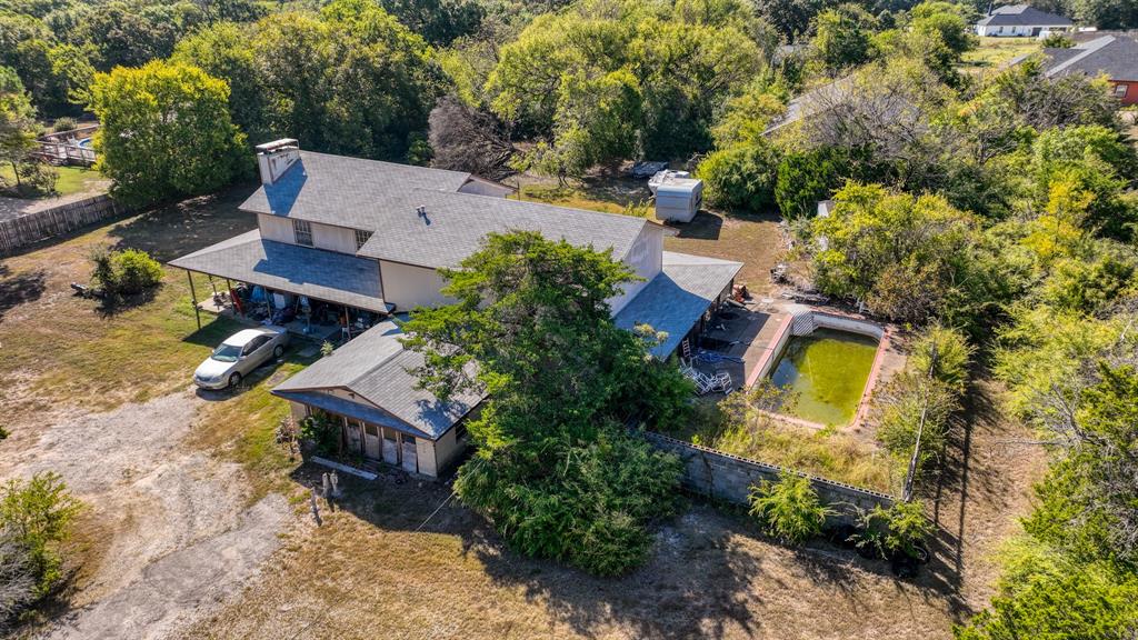 1922 West Pleasant Run Road DeSoto, TX 75115 - Photo 7 of 8 an aerial view of a house with swimming pool and garden view