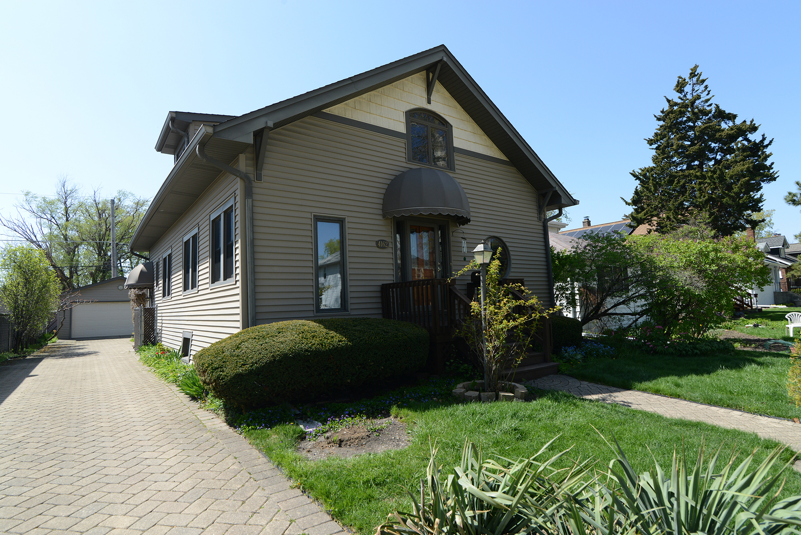 4162 Blanchan Avenue Brookfield, IL 60513 - Photo 1 of 39 a front view of a house with garden