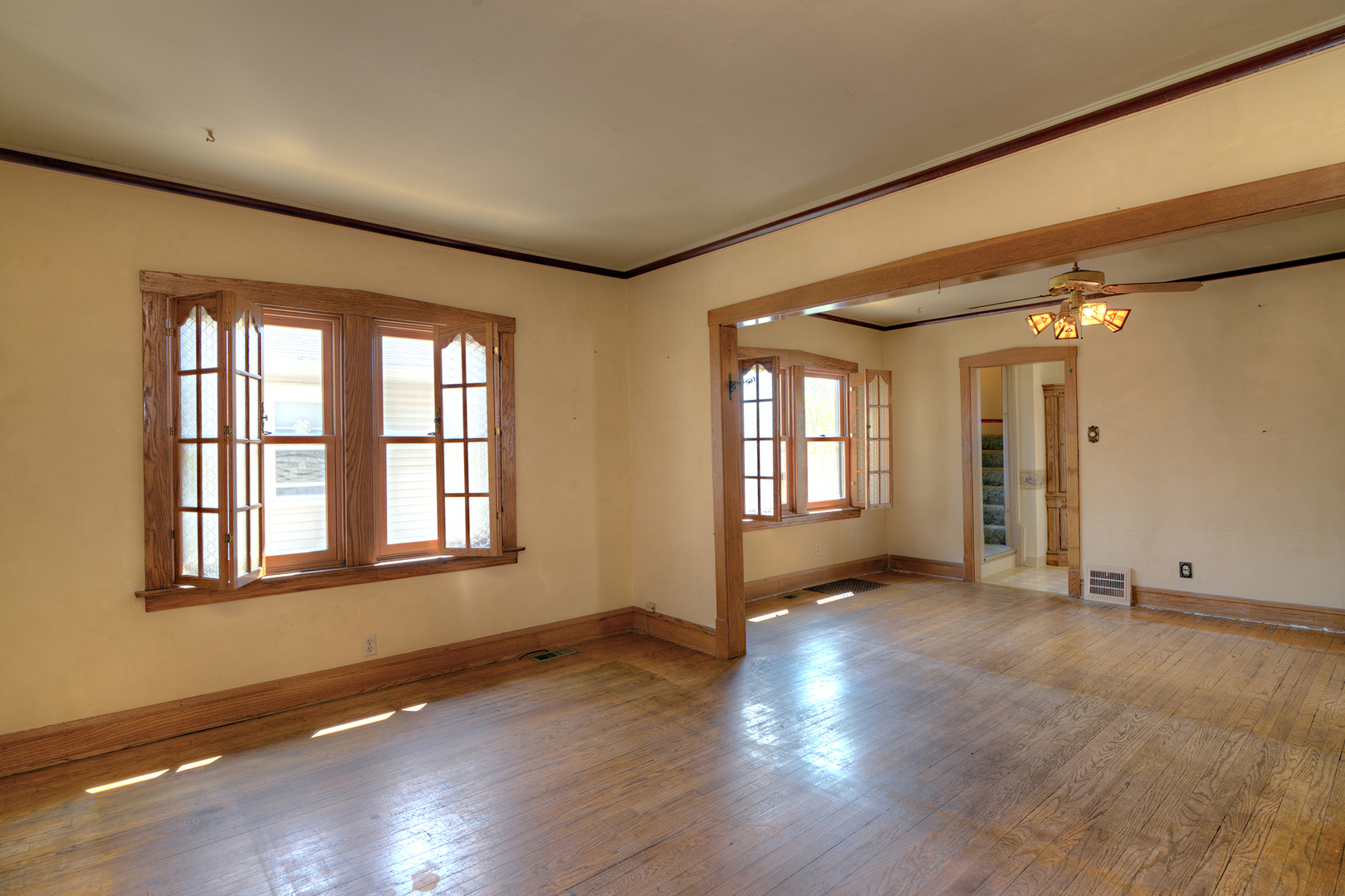 4162 Blanchan Avenue Brookfield, IL 60513 - Photo 11 of 39 a view of an empty room with wooden floor and a window
