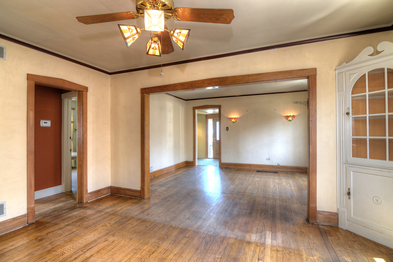 4162 Blanchan Avenue Brookfield, IL 60513 - Photo 14 of 39 a view of a hallway with wooden floor and a chandelier
