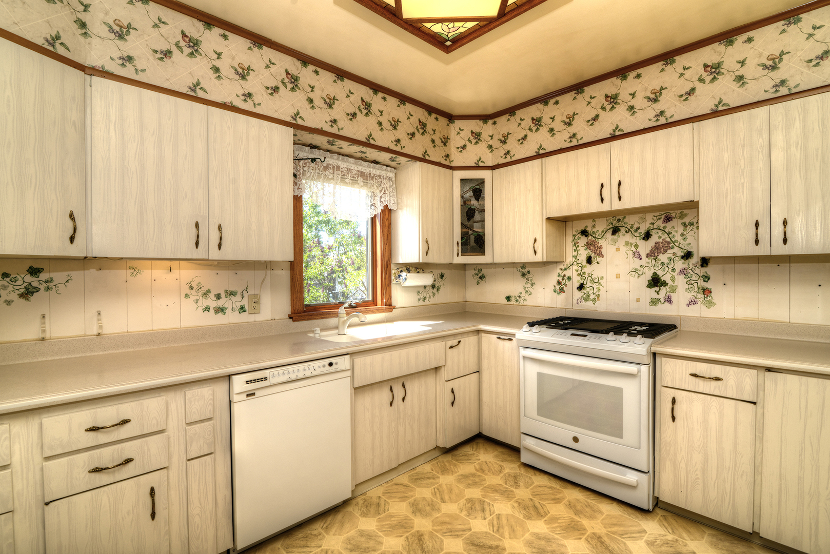 4162 Blanchan Avenue Brookfield, IL 60513 - Photo 22 of 39 a kitchen with white cabinets and white appliances