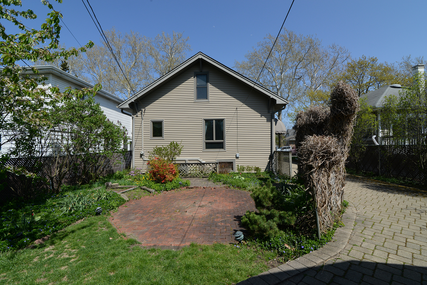 4162 Blanchan Avenue Brookfield, IL 60513 - Photo 37 of 39 a view of a house with a yard and garden